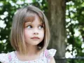 Urocza dziewczynka o niebieskich oczach, Justyna. Jej imię oznacza "sprawiedliwa", a ona sama wygląda na ciekawską i pełną życia.