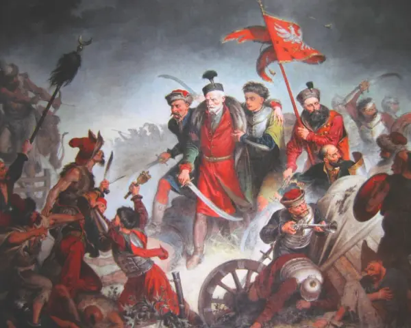 Bitwa pod Chocimiem 1621: Polacy z chorągwią zwyciężają. Dynamiczna scena walki, szable, broń palna, żołnierze w barwnych strojach.