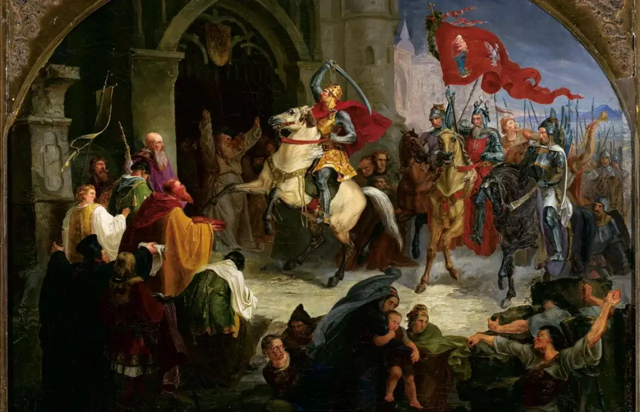 Rycerze na koniach, z chorągwią, w tłumie ludzi. Scena sugeruje uroczystość lub wydarzenie historyczne, być może związane z momentem, kiedy zmarł Bolesław Chrobry.